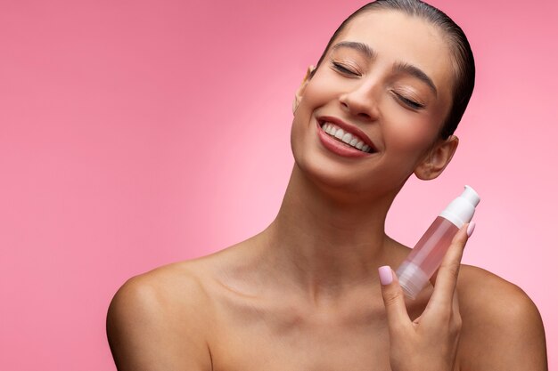 Beautiful portrait of woman on pink