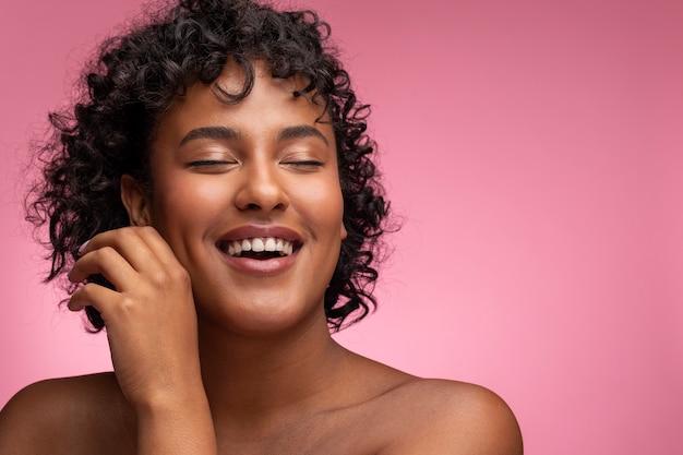 Beautiful portrait of woman on pink