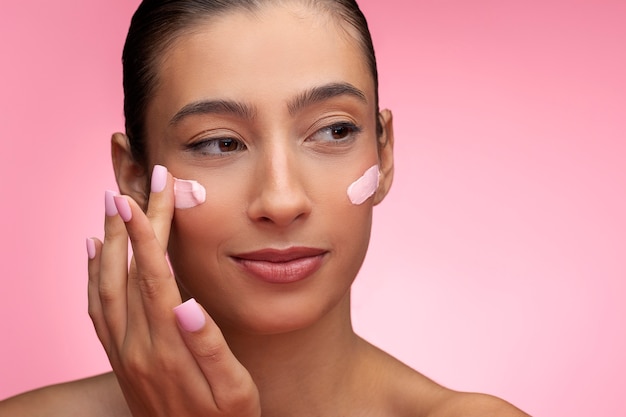 Beautiful portrait of woman on pink