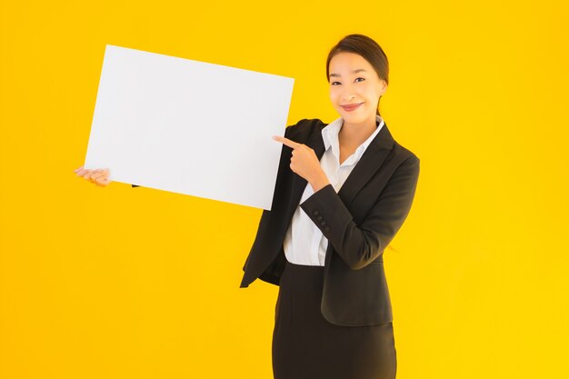 Beautiful portrait young asian woman with empty board