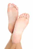 Free photo beautiful pure wellgroomed female a foot and a heel lifted upwards. isolated on