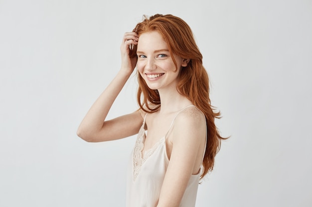 Beautiful redhead model with freckles smiling 