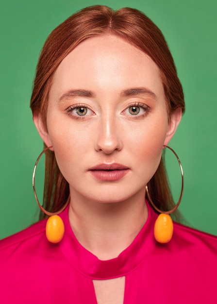 Beautiful redhead woman wearing fruit earrings