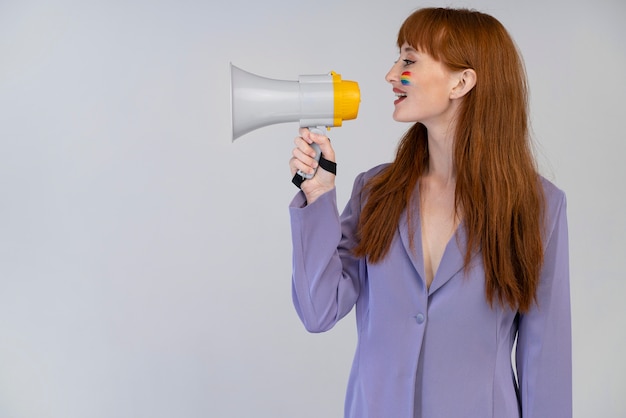 Free photo beautiful redhead woman with rainbow symbol