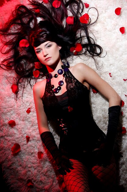 Beautiful and romantic woman with red rose