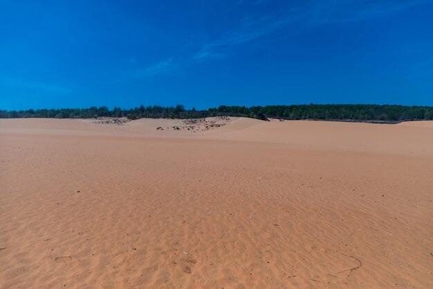 Beautiful sand dunes of Mui Ne, Vientam under a clear blue sky