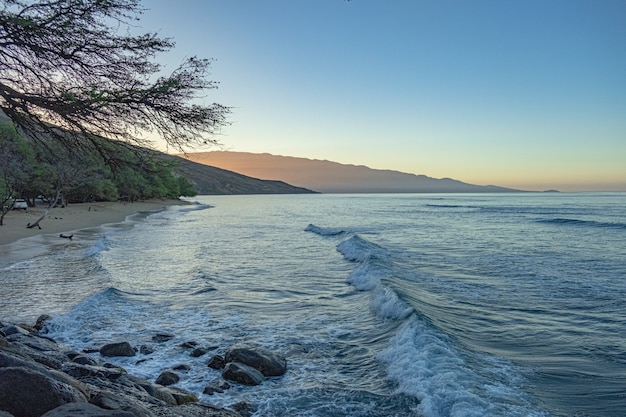 Beautiful sandy beach with blue sea and sky