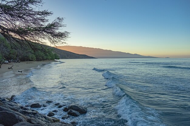 Beautiful sandy beach with blue sea and sky