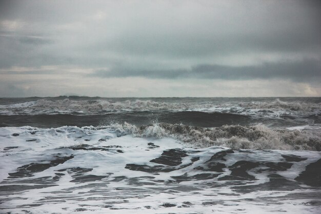 Beautiful scenery of amazing strong ocean waves during misty weather in the countryside