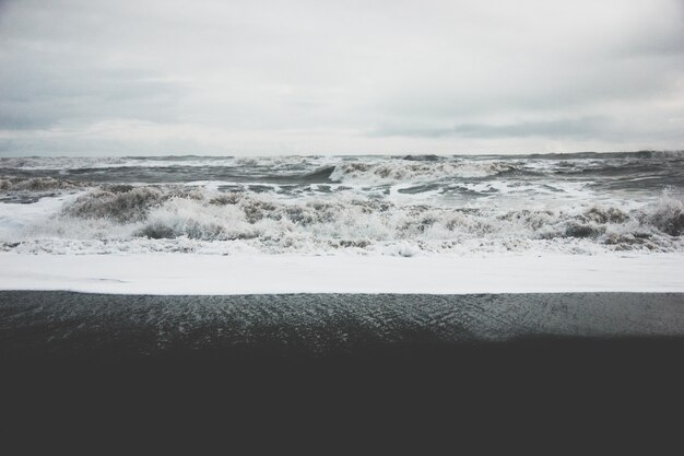 Beautiful scenery of amazing strong ocean waves during misty weather in the countryside