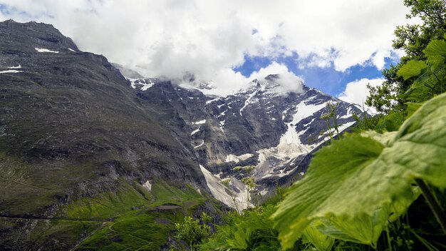 Beautiful scenery of a mountainous landscape covered with snow under a cloudy sky