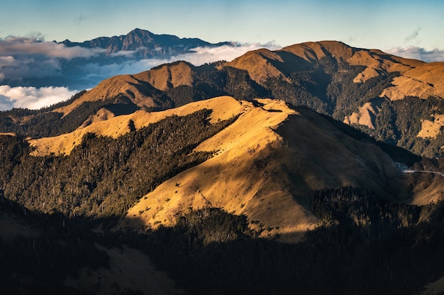 Beautiful scenery of a mountainous landscape with high rocky mountains under a cloudy sky