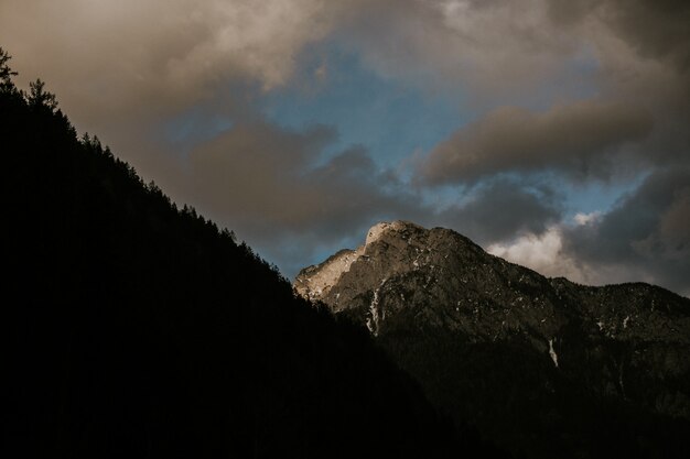 Beautiful scenery of a range of high rocky mountains under a cloudy sky