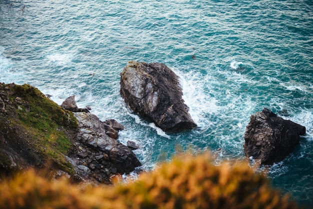 Beautiful scenery of rock formations by the sea during daytime