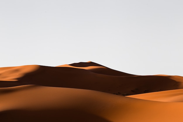 Beautiful scenery of sand dunes in a desert area on a sunny day