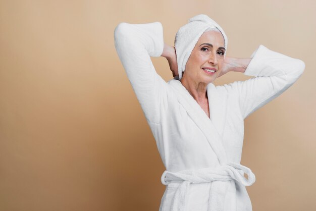 Beautiful senior woman in bathrobe