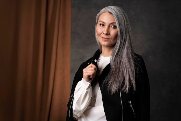 Beautiful senior woman portrait wearing black jacket