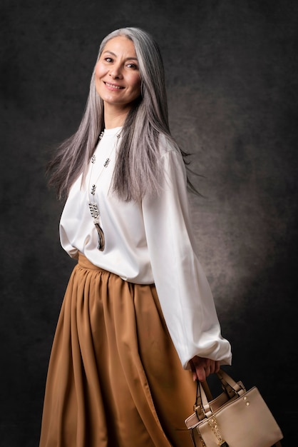 Beautiful senior woman portrait with hand bag