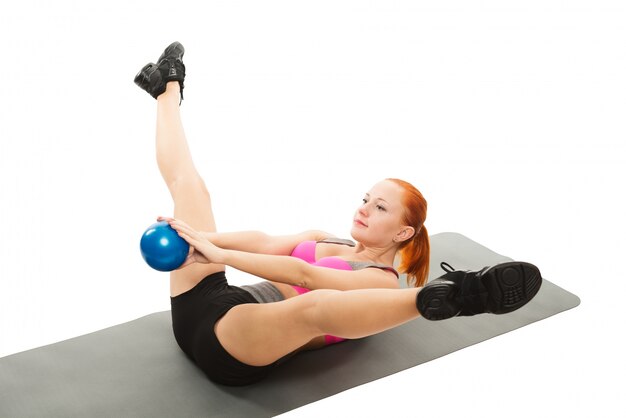 Beautiful sensual woman doing fitness with ball