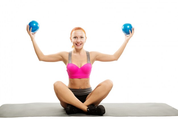 Beautiful sensual woman doing fitness with balls