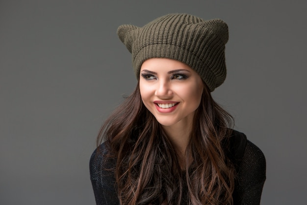 Beautiful sexy young woman in a funny hat with ears