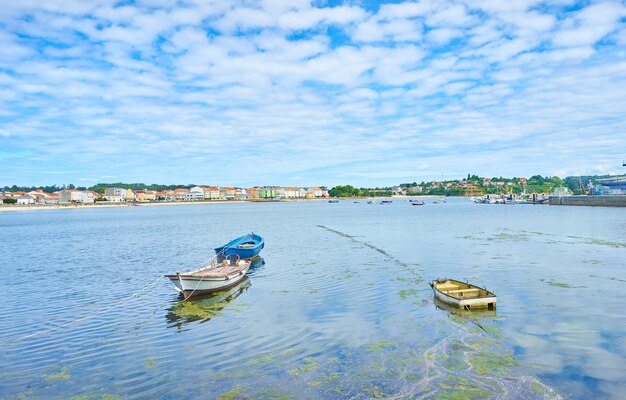 Beautiful shot of boats on the water under a bright cloudy sky