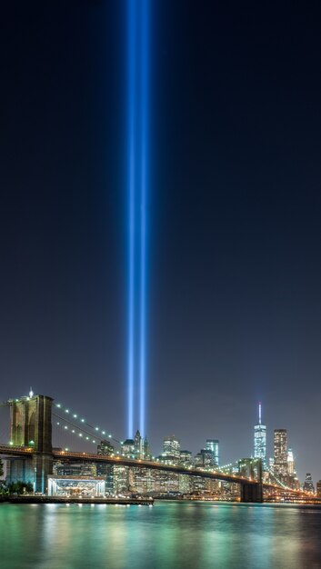 Beautiful shot of brooklyn bridge park of new york city in USA with a blue ray of light in the sky