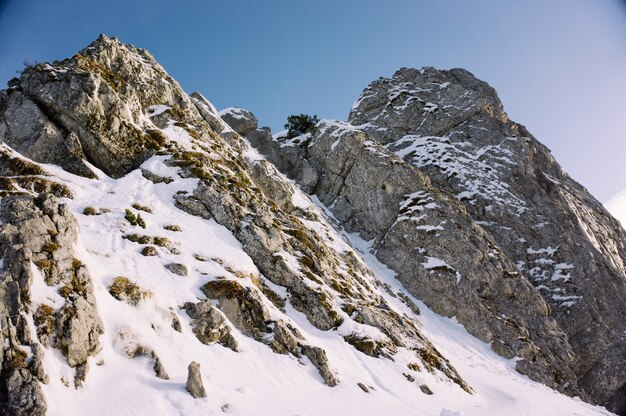 Beautiful shot of high rocky mountains covered with snow