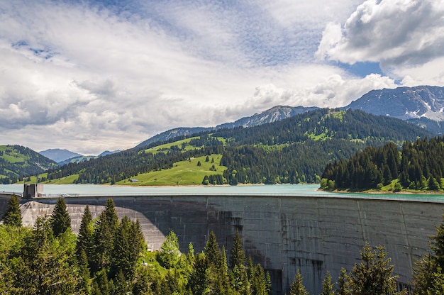 Beautiful shot of Lac de l'Hongrin dam with mountains under a clear sky