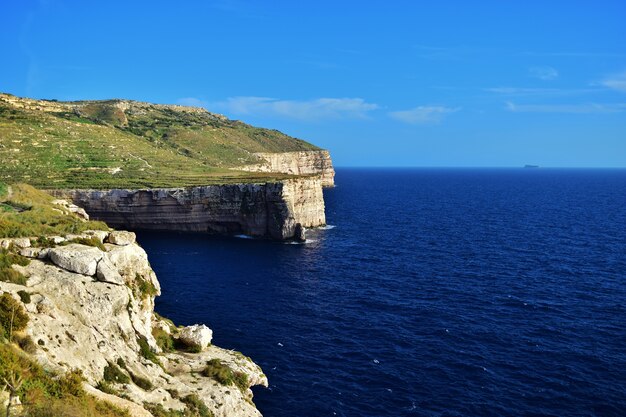 Beautiful shot of limestone sea cliffs in Migra il-Ferha, Maltese Islands