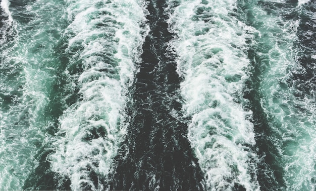 Beautiful shot of a motorboat foam trace in the sea