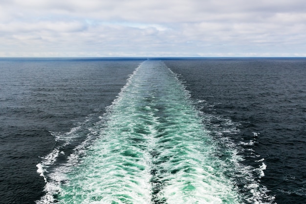 Beautiful shot of a motorboat foam trace in the sea