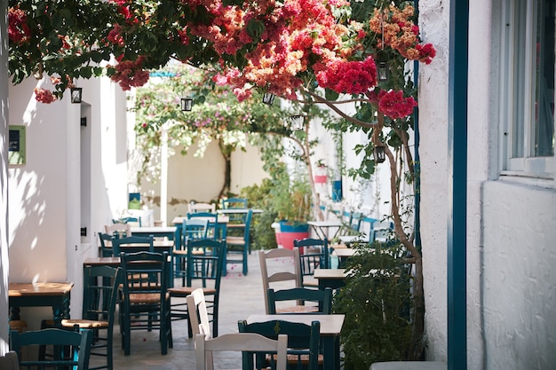 Beautiful shot of an outdoor cafe in the narrow bystreet in Paros, Greece