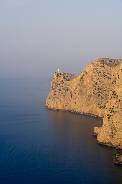 Beautiful shot of rocky cliffs of the sea on a sunny day