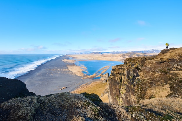 Beautiful shot of the seashore under a clear blue sky at daytime