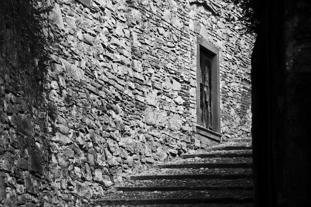 Free photo beautiful shot of a stairway in the middle of buildings in black and white