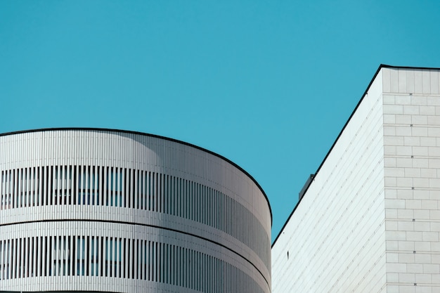 Beautiful Shot of the Top of White Buildings with Clear Blue Sky