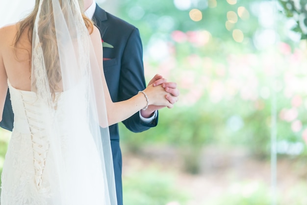 Beautiful shot of wedding couple dances in the park