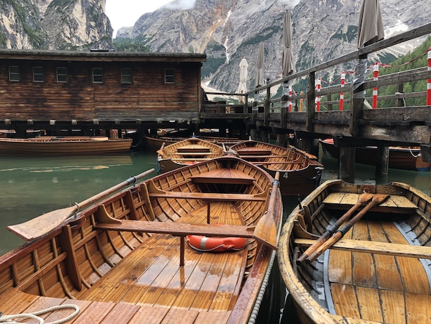 Beautiful shot of wooden boats on Braies lake