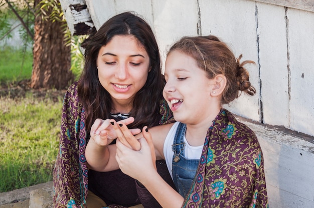 Beautiful sisters playing with their fingers