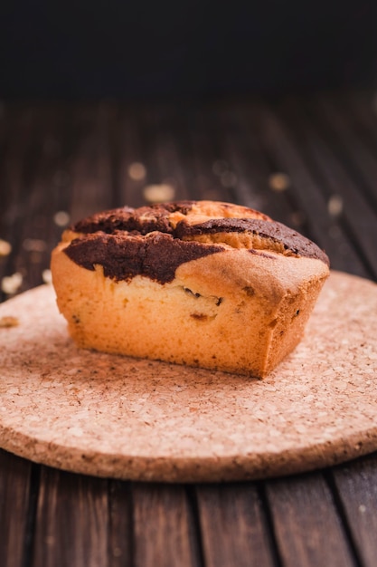 Beautiful small cake on wooden table