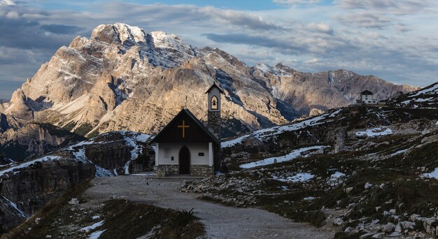 Beautiful small church in the snowy Italian Alps in winter