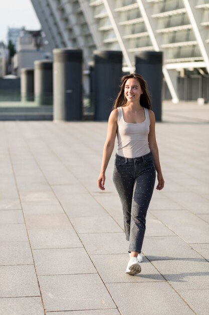 Free photo beautiful smiley woman walking