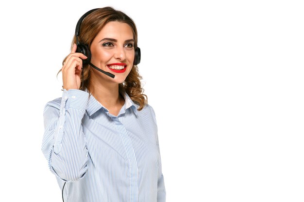 Beautiful, smiling, charming woman, operator with headset, taking calls. 