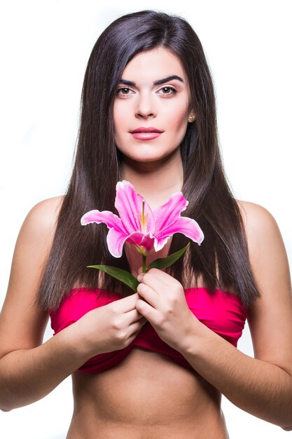 Beautiful smiling woman with a lily isolated on white background