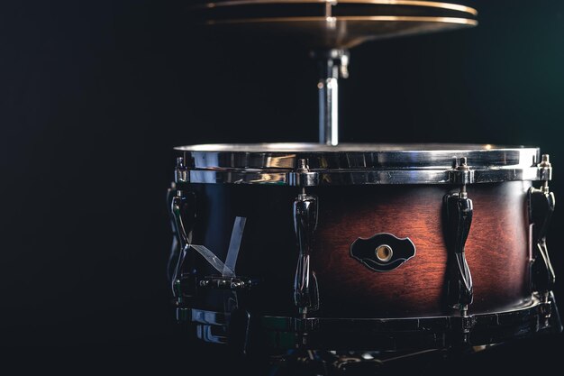 Beautiful snare drum on a black background close up