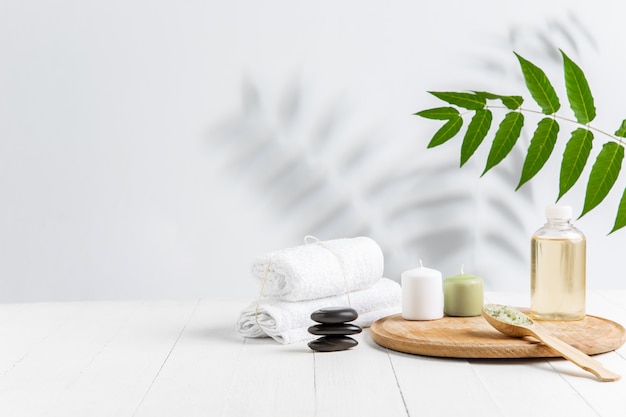 Beautiful spa composition on massage table in wellness center, copyspace