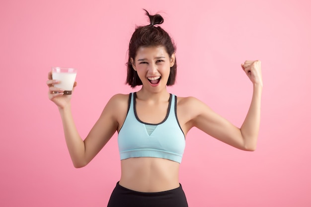 beautiful sport woman drinking milk