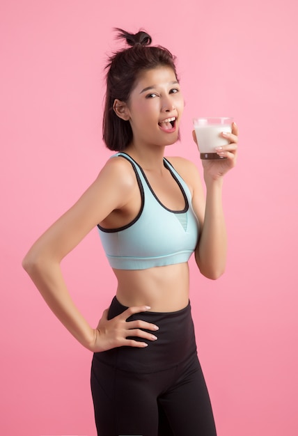 beautiful sport woman drinking milk