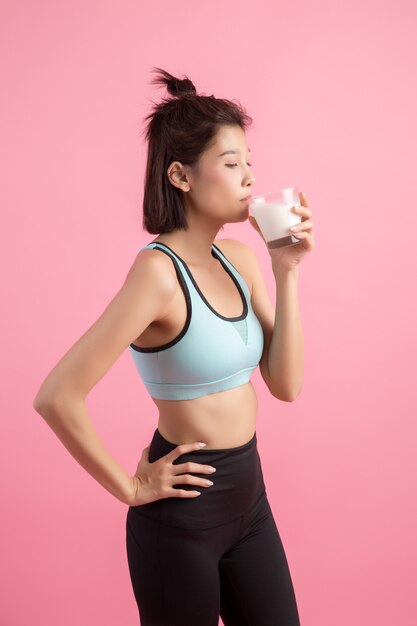 beautiful sport woman drinking milk